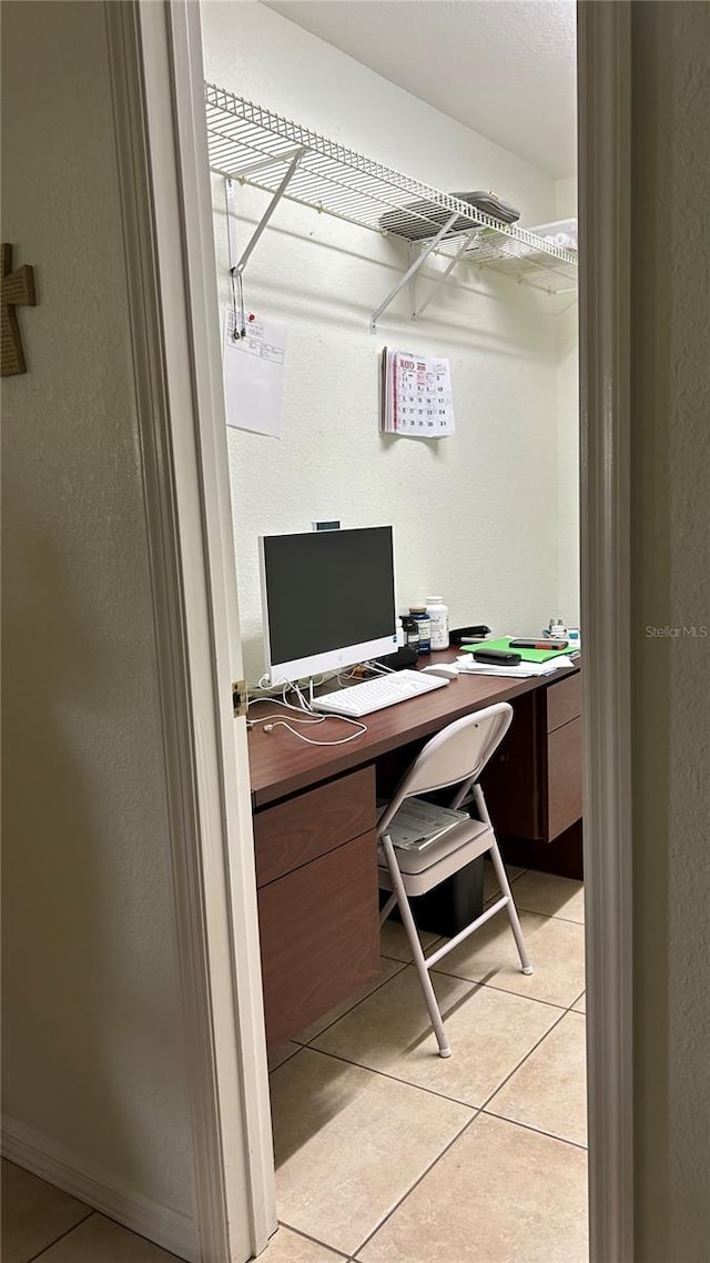 1717 W Orangewood Ln, Avon Park, FL 33825 - home office with light tile patterned flooring and a textured wall