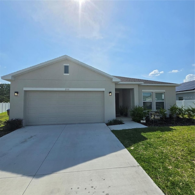 200 Citrine Loop, Kissimmee, FL 34758 - single story home featuring stucco siding, an attached garage, concrete driveway, and a front lawn