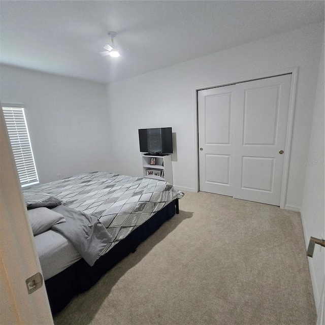 200 Citrine Loop, Kissimmee, FL 34758 - bedroom with carpet flooring, a closet, baseboards, and ceiling fan