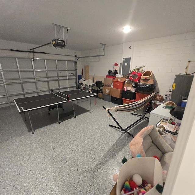 200 Citrine Loop, Kissimmee, FL 34758 - garage with a garage door opener, electric panel, and concrete block wall