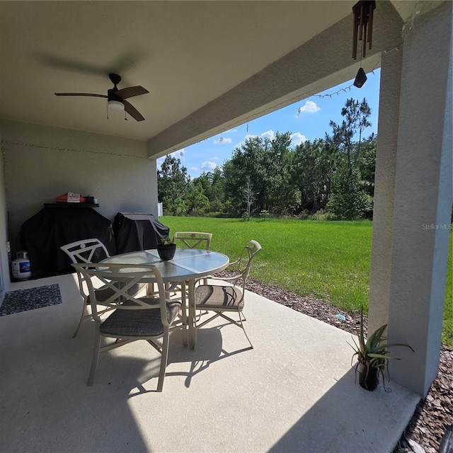 200 Citrine Loop, Kissimmee, FL 34758 - view of patio / terrace with ceiling fan, outdoor dining area, and grilling area