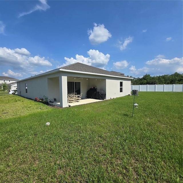 200 Citrine Loop, Kissimmee, FL 34758 - rear view of property featuring a patio area, stucco siding, and central AC