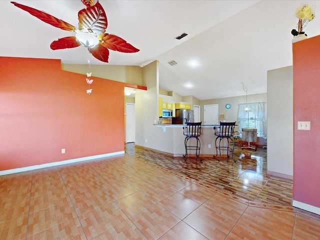 3811 Gator Bay Ln, Saint Cloud, FL 34772 - living area featuring a ceiling fan, vaulted ceiling, baseboards, and tile patterned flooring