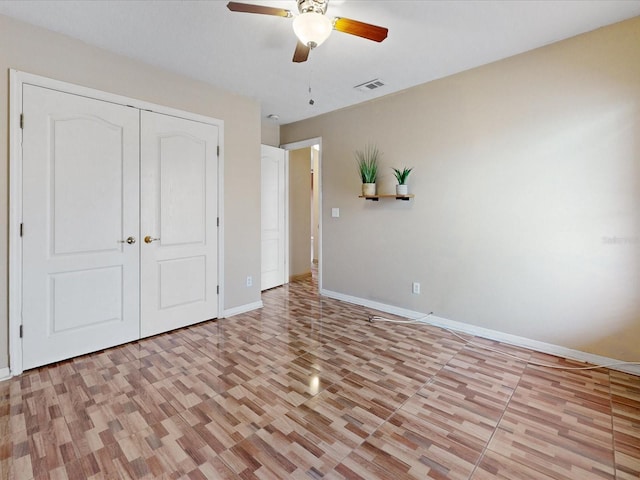3811 Gator Bay Ln, Saint Cloud, FL 34772 - unfurnished bedroom featuring baseboards, a closet, a ceiling fan, and light wood finished floors