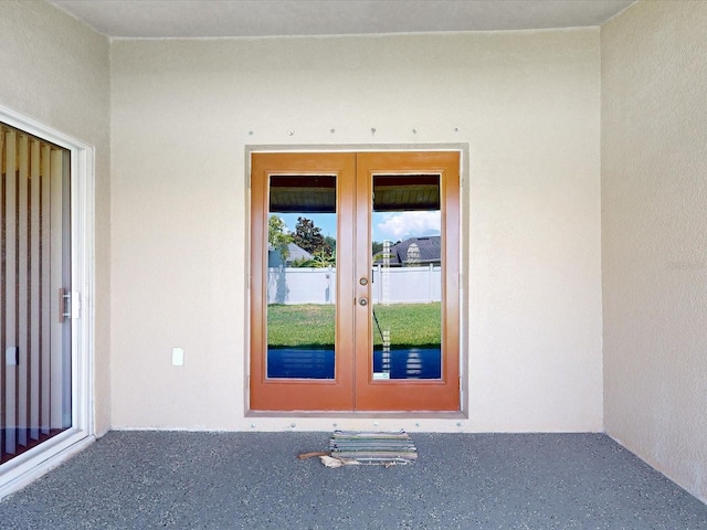 3811 Gator Bay Ln, Saint Cloud, FL 34772 - view of exterior entry with french doors and stucco siding