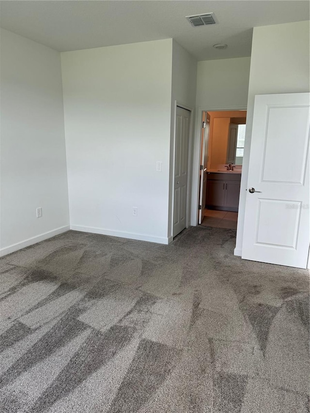 4053 Redbridge Loop, Davenport, FL 33837 - unfurnished bedroom featuring carpet flooring and baseboards