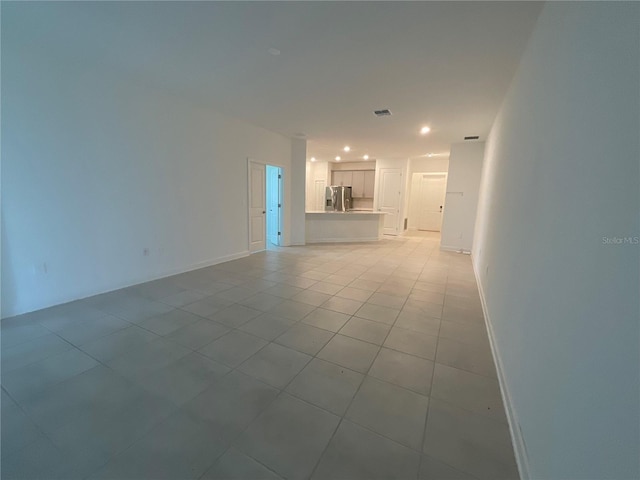 4053 Redbridge Loop, Davenport, FL 33837 - unfurnished living room with tile patterned flooring and recessed lighting