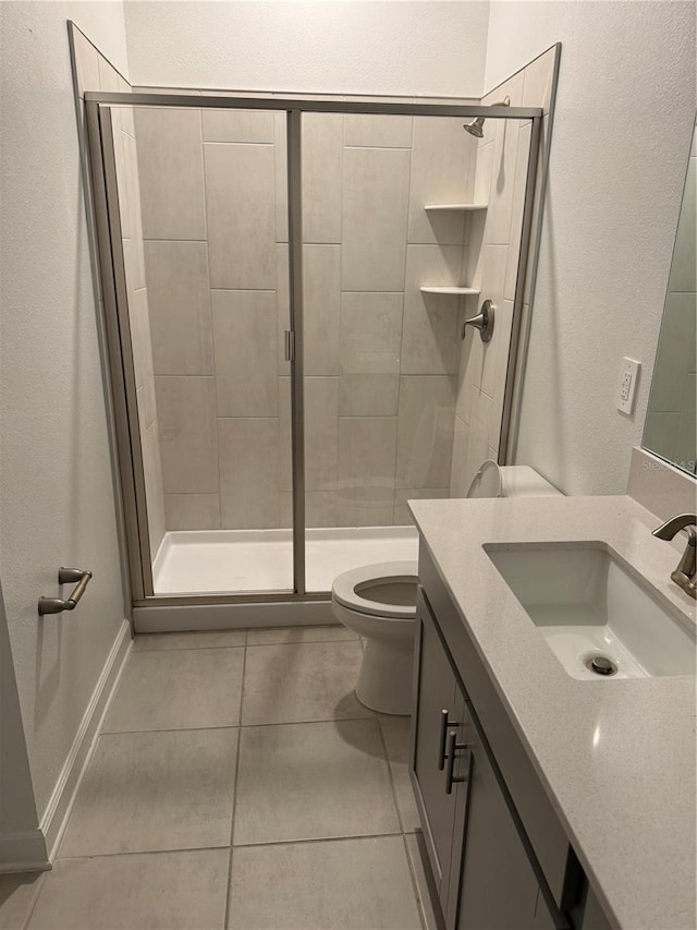 4053 Redbridge Loop, Davenport, FL 33837 - bathroom featuring vanity, toilet, a shower stall, and tile patterned floors