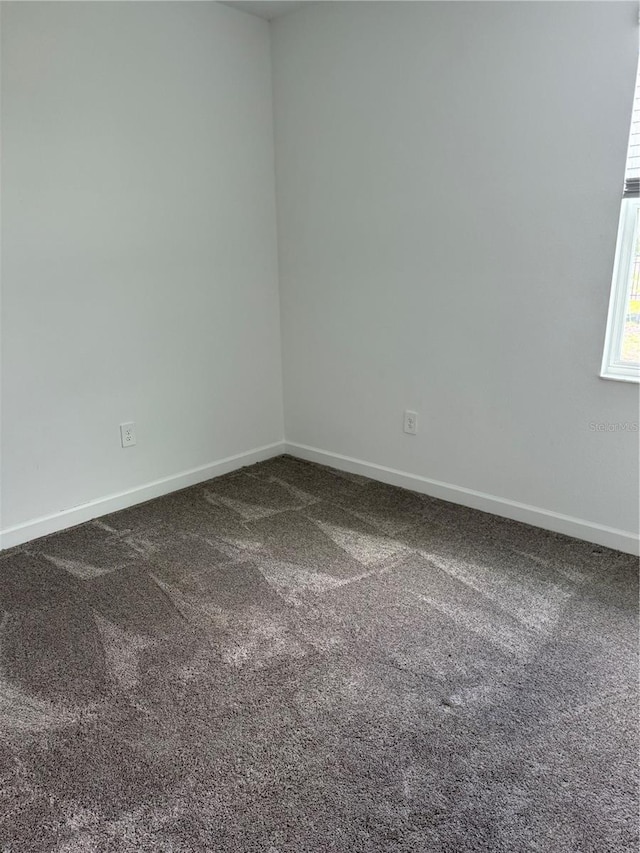 4053 Redbridge Loop, Davenport, FL 33837 - spare room featuring carpet flooring and baseboards