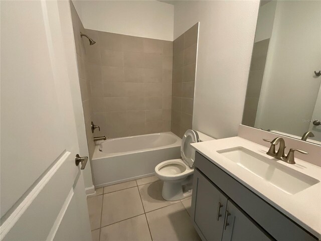 4053 Redbridge Loop, Davenport, FL 33837 - full bath featuring vanity, toilet, bathtub / shower combination, and tile patterned flooring