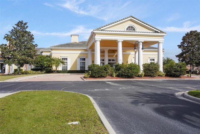 4053 Redbridge Loop, Davenport, FL 33837 - view of building exterior with curved driveway