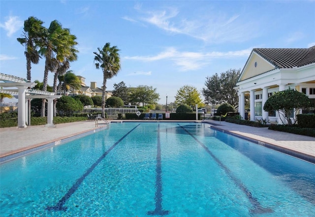 4053 Redbridge Loop, Davenport, FL 33837 - community pool with a pergola and a patio area