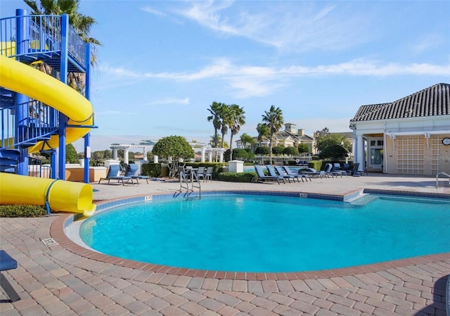 4053 Redbridge Loop, Davenport, FL 33837 - community pool with a patio and a water slide