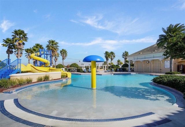 4053 Redbridge Loop, Davenport, FL 33837 - community pool featuring a water slide