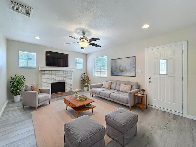 2409 E Magnolia St, Lakeland, FL 33801 - living room featuring plenty of natural light, light wood finished floors, baseboards, a ceiling fan, and recessed lighting