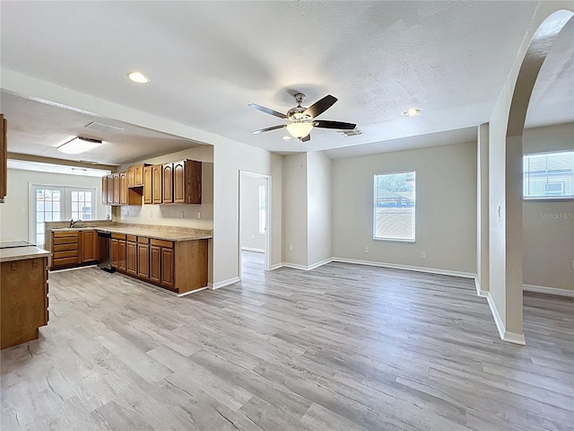2409 E Magnolia St, Lakeland, FL 33801 - kitchen with light wood-type flooring, plenty of natural light, light countertops, recessed lighting, and a textured ceiling