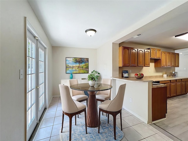 2409 E Magnolia St, Lakeland, FL 33801 - dining area with light tile patterned flooring