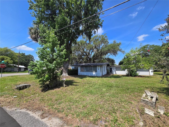 2704 Sample St, Kissimmee, FL 34744 - view of front of home featuring a front yard