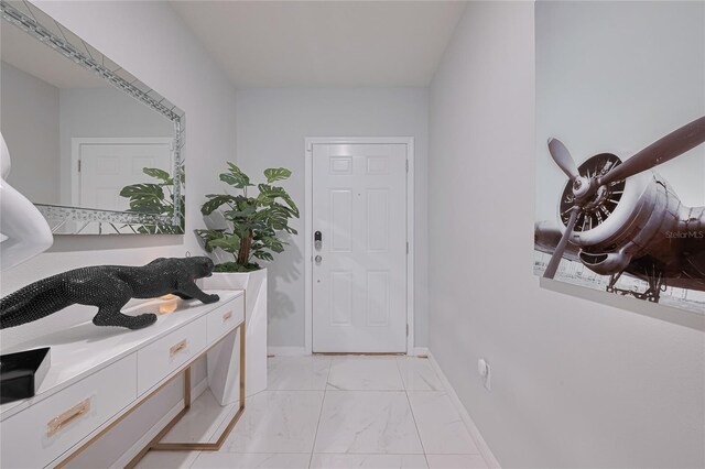 454 Hamlet Loop, Davenport, FL 33837 - entrance foyer featuring light marble finish floors and baseboards