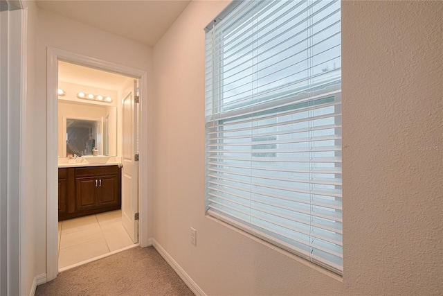 454 Hamlet Loop, Davenport, FL 33837 - hallway with light carpet and baseboards