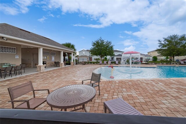 454 Hamlet Loop, Davenport, FL 33837 - view of swimming pool featuring a patio, outdoor dining space, and a residential view