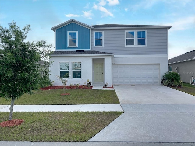 1404 Axel Cir, Winter Haven, FL 33880 - traditional-style home featuring an attached garage, concrete driveway, and a front yard