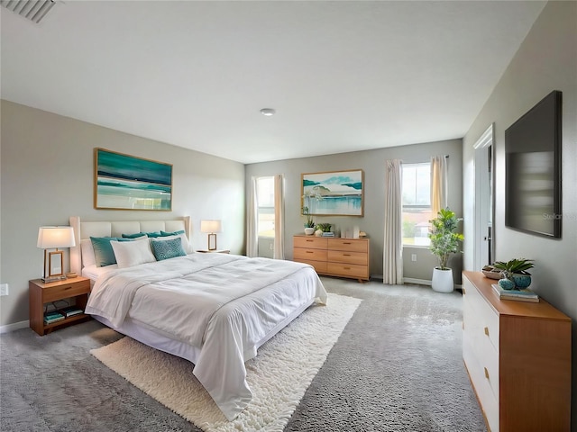 1404 Axel Cir, Winter Haven, FL 33880 - carpeted bedroom with multiple windows and baseboards
