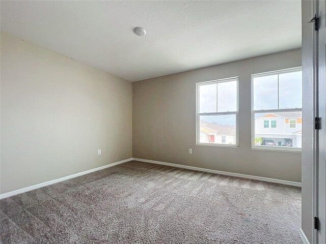 1404 Axel Cir, Winter Haven, FL 33880 - unfurnished room featuring carpet floors and baseboards