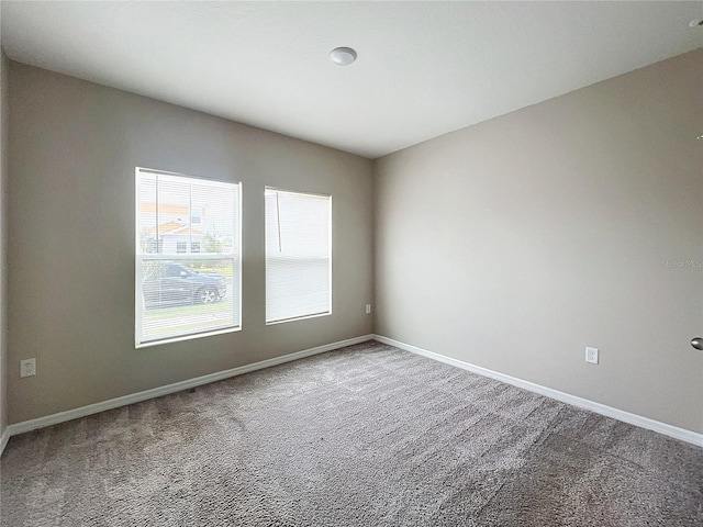 1404 Axel Cir, Winter Haven, FL 33880 - carpeted spare room featuring baseboards