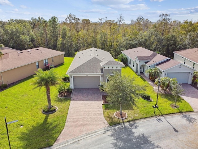 1703 Encinitas Way, Kissimmee, FL 34759 - view of subject property featuring a forest