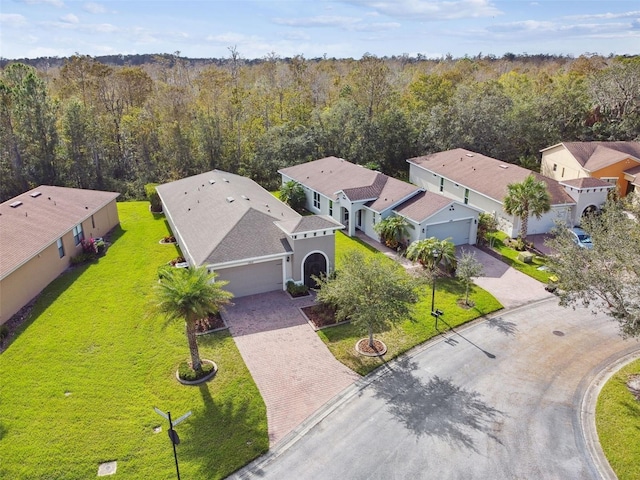 1703 Encinitas Way, Kissimmee, FL 34759 - aerial perspective of suburban area featuring a heavily wooded area