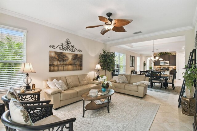 1703 Encinitas Way, Kissimmee, FL 34759 - living area with healthy amount of natural light, ceiling fan, crown molding, light tile patterned floors, and a chandelier