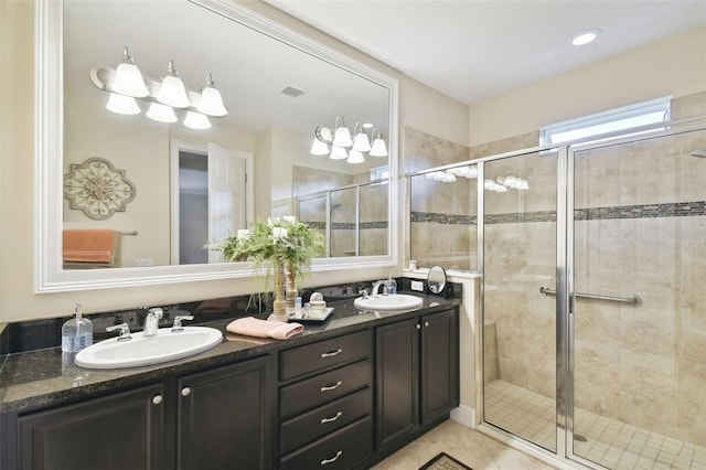 1703 Encinitas Way, Kissimmee, FL 34759 - bathroom with double vanity, a shower stall, and tile patterned flooring