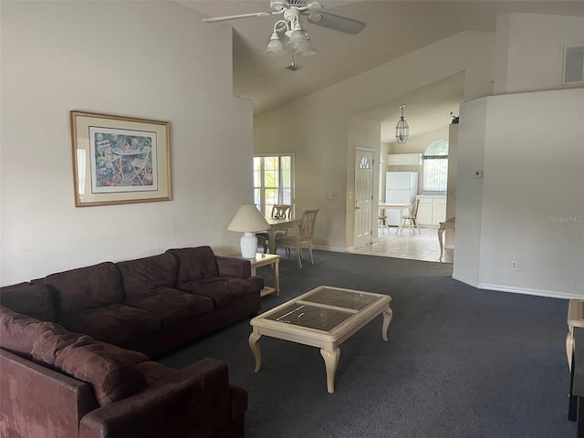 123 S Roma Way, Kissimmee, FL 34746 - living area featuring a ceiling fan, vaulted ceiling, carpet floors, and baseboards