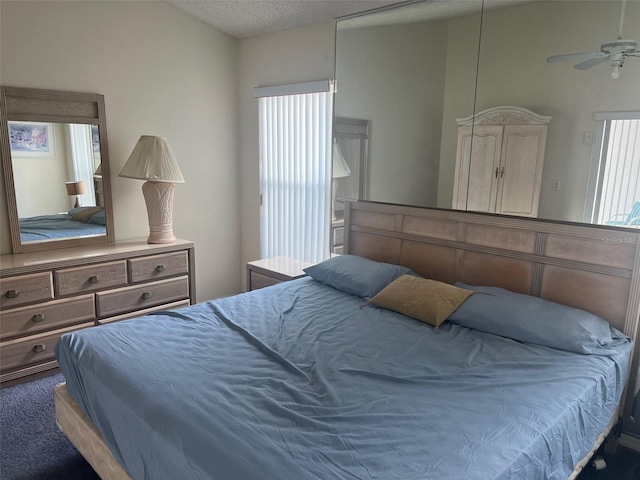 123 S Roma Way, Kissimmee, FL 34746 - carpeted bedroom with a textured ceiling