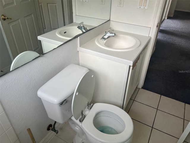 123 S Roma Way, Kissimmee, FL 34746 - bathroom featuring toilet, vanity, and tile patterned floors