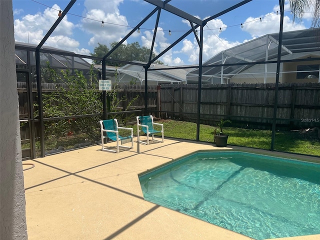 123 S Roma Way, Kissimmee, FL 34746 - view of pool featuring a fenced backyard, a lanai, and a patio