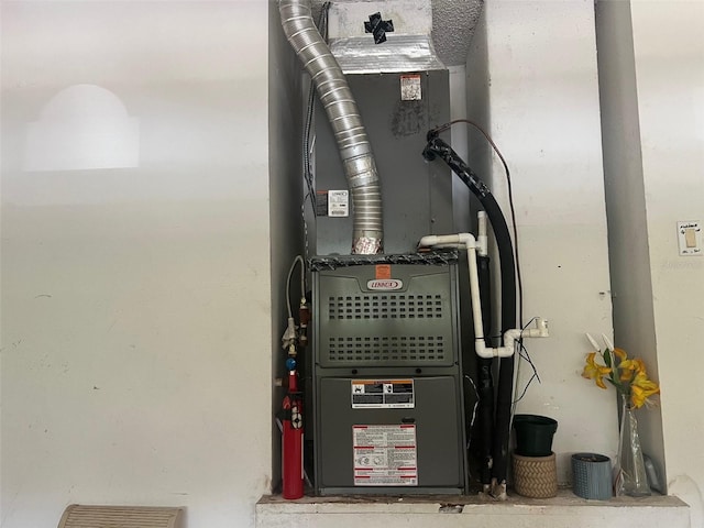 123 S Roma Way, Kissimmee, FL 34746 - utility room featuring heating unit