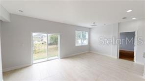 212 Grouper Ct, Poinciana, FL 34759 - unfurnished room with baseboards and recessed lighting