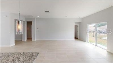 212 Grouper Ct, Poinciana, FL 34759 - empty room with baseboards