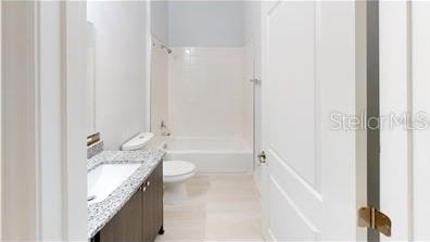212 Grouper Ct, Poinciana, FL 34759 - bathroom with vanity, toilet, and shower / tub combination