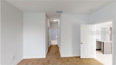 212 Grouper Ct, Poinciana, FL 34759 - unfurnished bedroom featuring baseboards and carpet floors