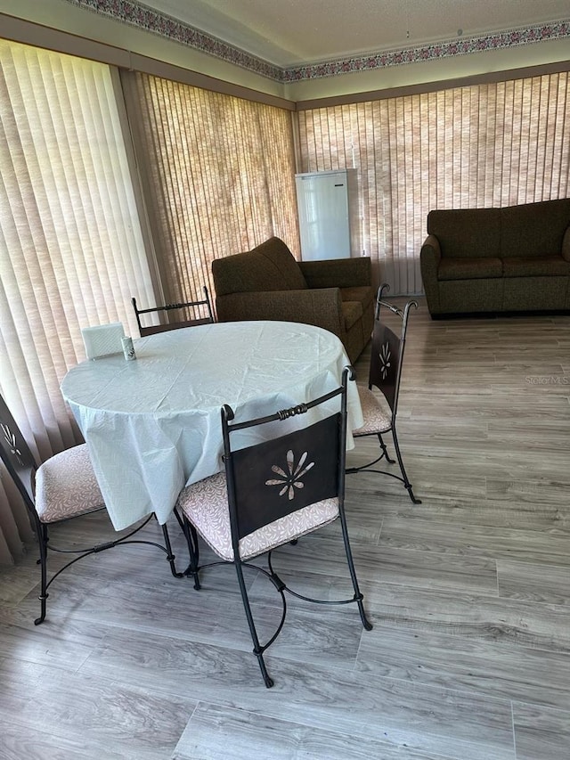 12322 Alta Mira St, North Port, FL 34287 - dining area featuring wood finished floors