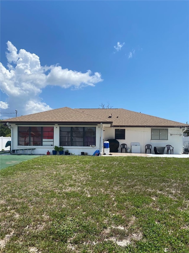 12322 Alta Mira St, North Port, FL 34287 - view of front of property with a front yard and a patio area