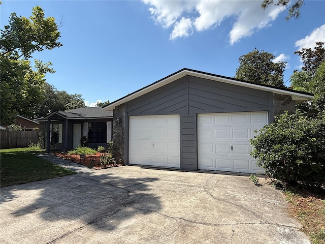 6489 Creation St, Saint Cloud, FL 34771 - view of front facade featuring driveway and an attached garage