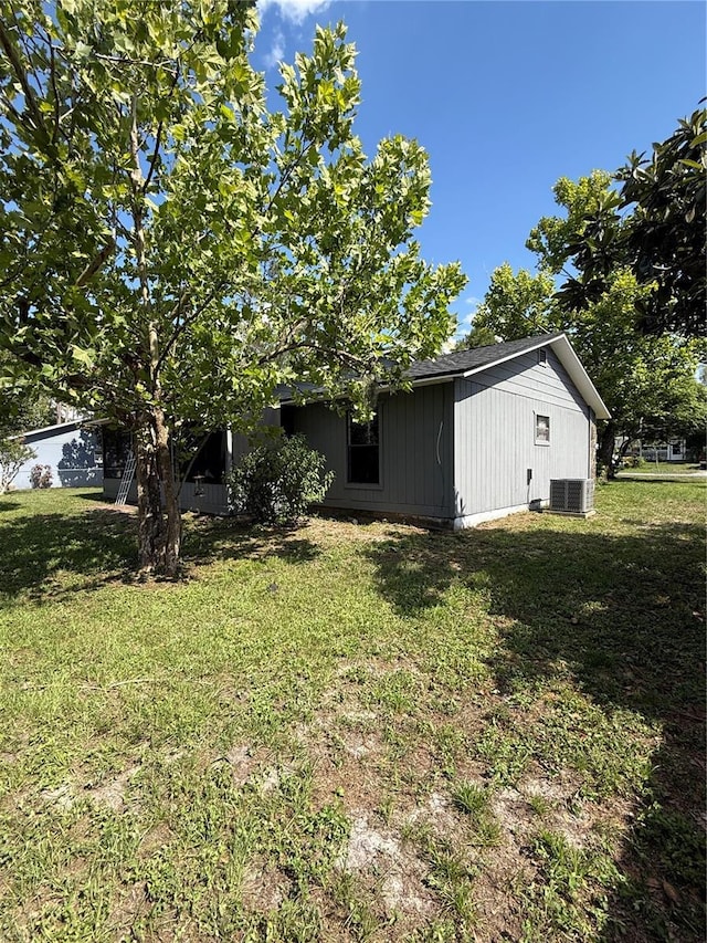 6489 Creation St, Saint Cloud, FL 34771 - view of green lawn with central AC unit