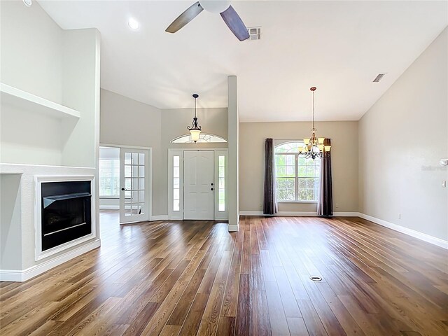 30 Lake Diamond Ave, Ocala, FL 34472 - entryway featuring dark wood-type flooring, a fireplace, baseboards, a chandelier, and a ceiling fan