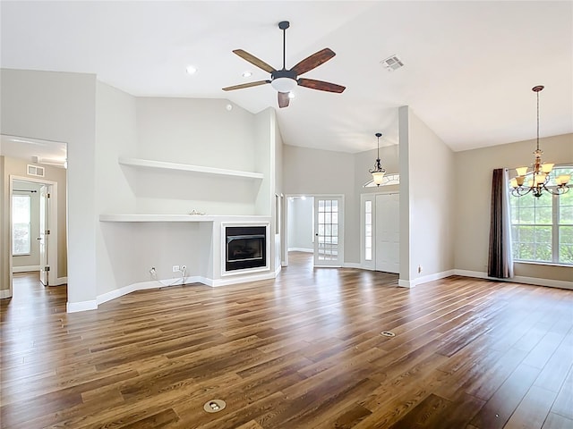 30 Lake Diamond Ave, Ocala, FL 34472 - unfurnished living room featuring dark wood finished floors, baseboards, a chandelier, and high vaulted ceiling