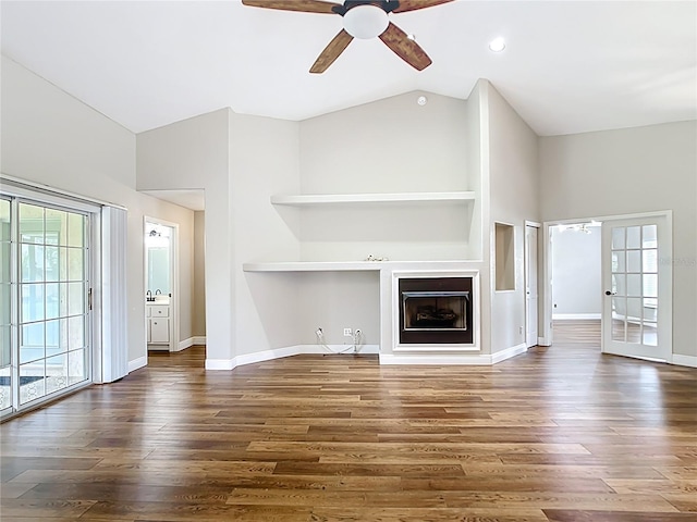 30 Lake Diamond Ave, Ocala, FL 34472 - unfurnished living room featuring ceiling fan, wood finished floors, lofted ceiling, baseboards, and a fireplace