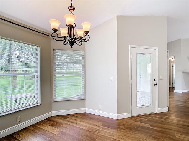 30 Lake Diamond Ave, Ocala, FL 34472 - unfurnished dining area featuring wood finished floors, a chandelier, plenty of natural light, and baseboards